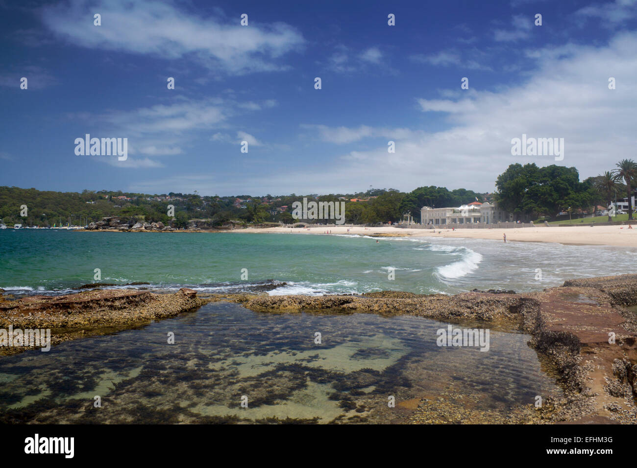 Balmoral Beach and Bathers Pavilion with rock pool in foreground Sydney Harbour Sydney New South Wales NSW Australia Stock Photo