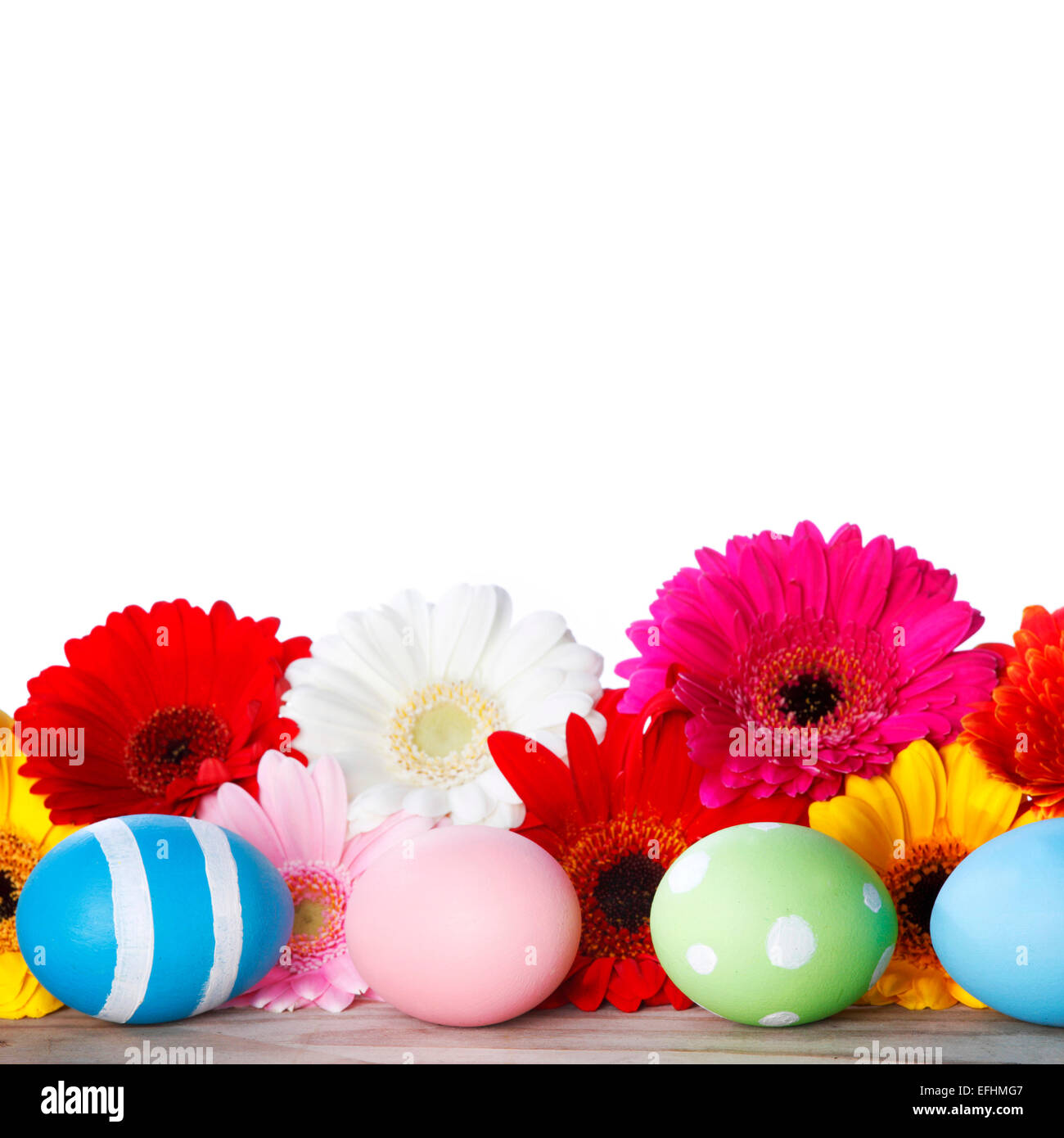 Beautiful painted easter eggs and flowers isolated on white background ...