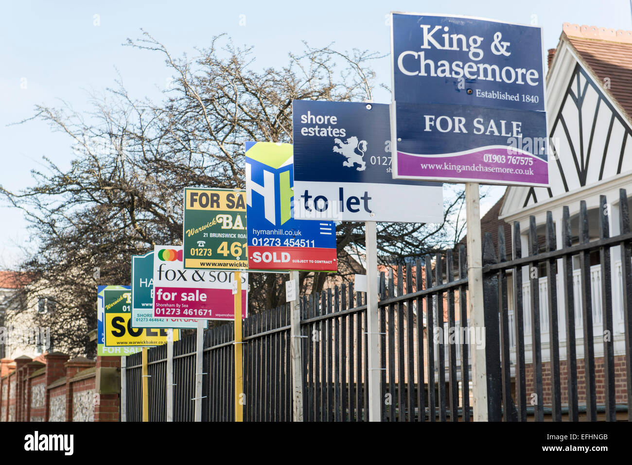 lots of estate agent boards for sale, sold, to let boards all lined up, great for house prices, property, housing market stories Stock Photo
