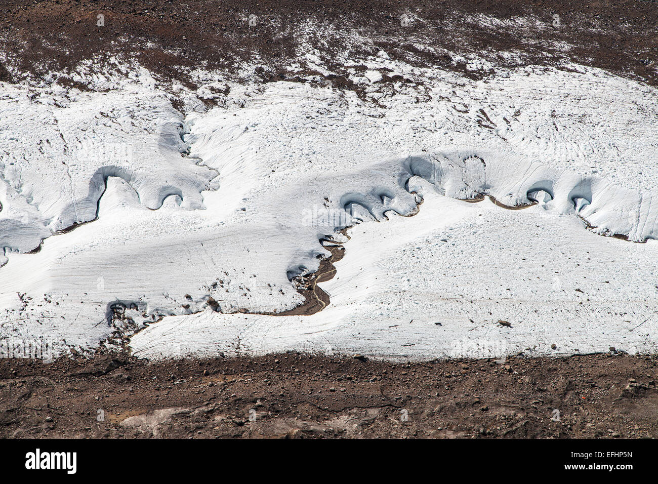 Streams winding through ice of Gorner glacier in the Swiss Alps. Stock Photo