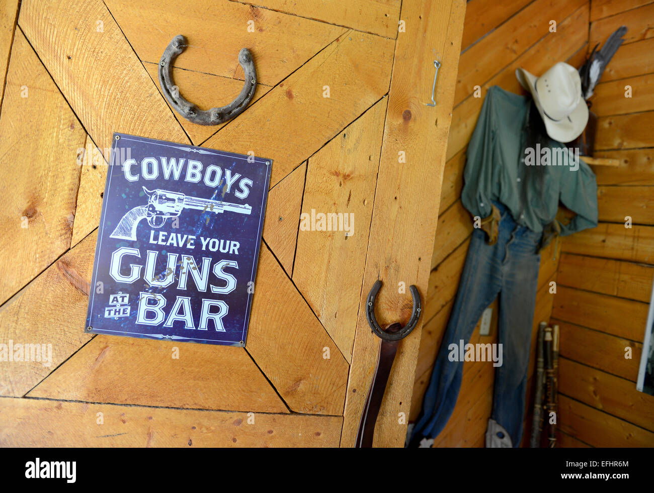 Cowboy sign, Leave your guns at the Bar, Wild West Stock Photo