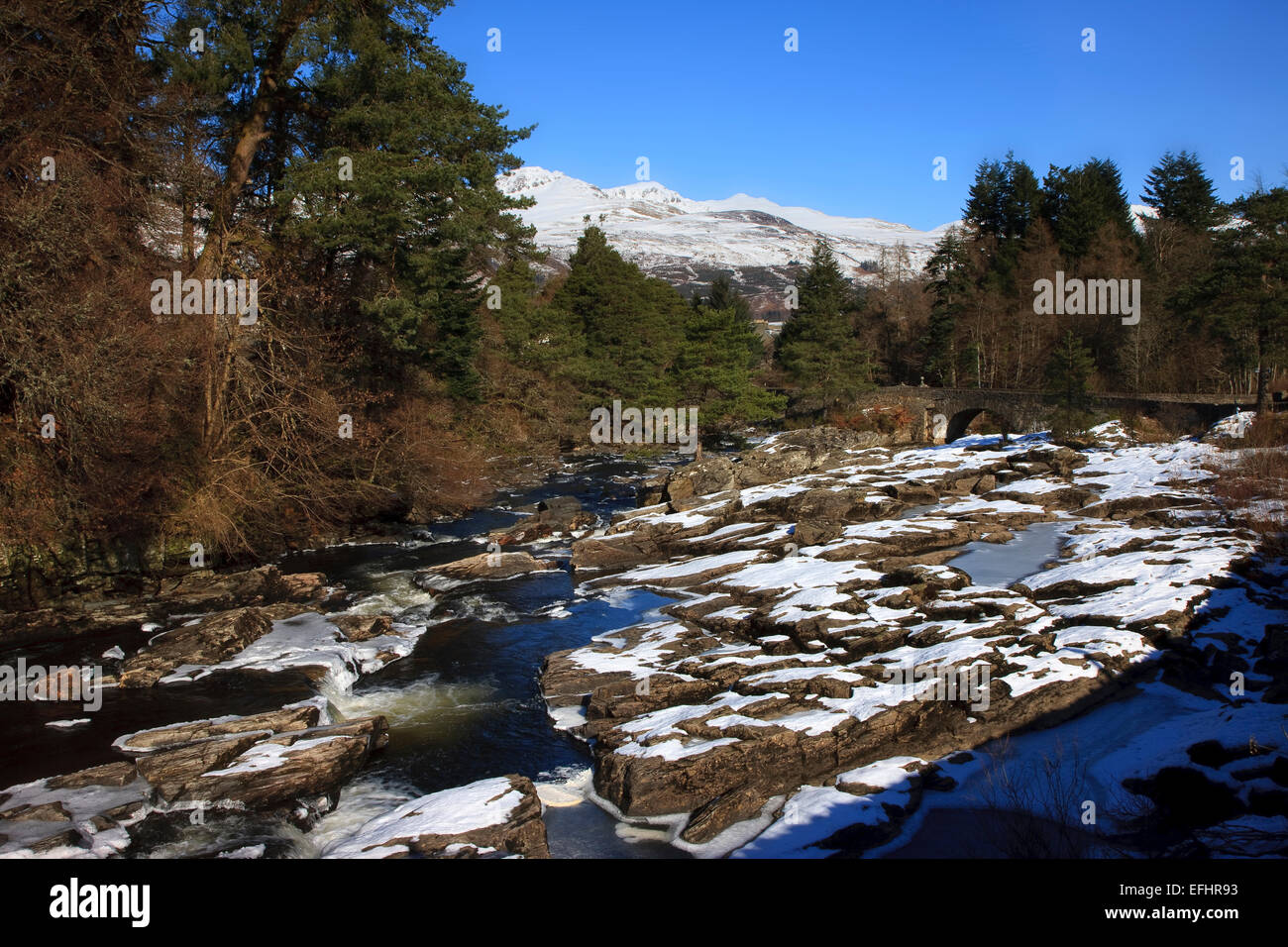 Winter arrives over the falls of Dochart, Killin, Perthsire Stock Photo