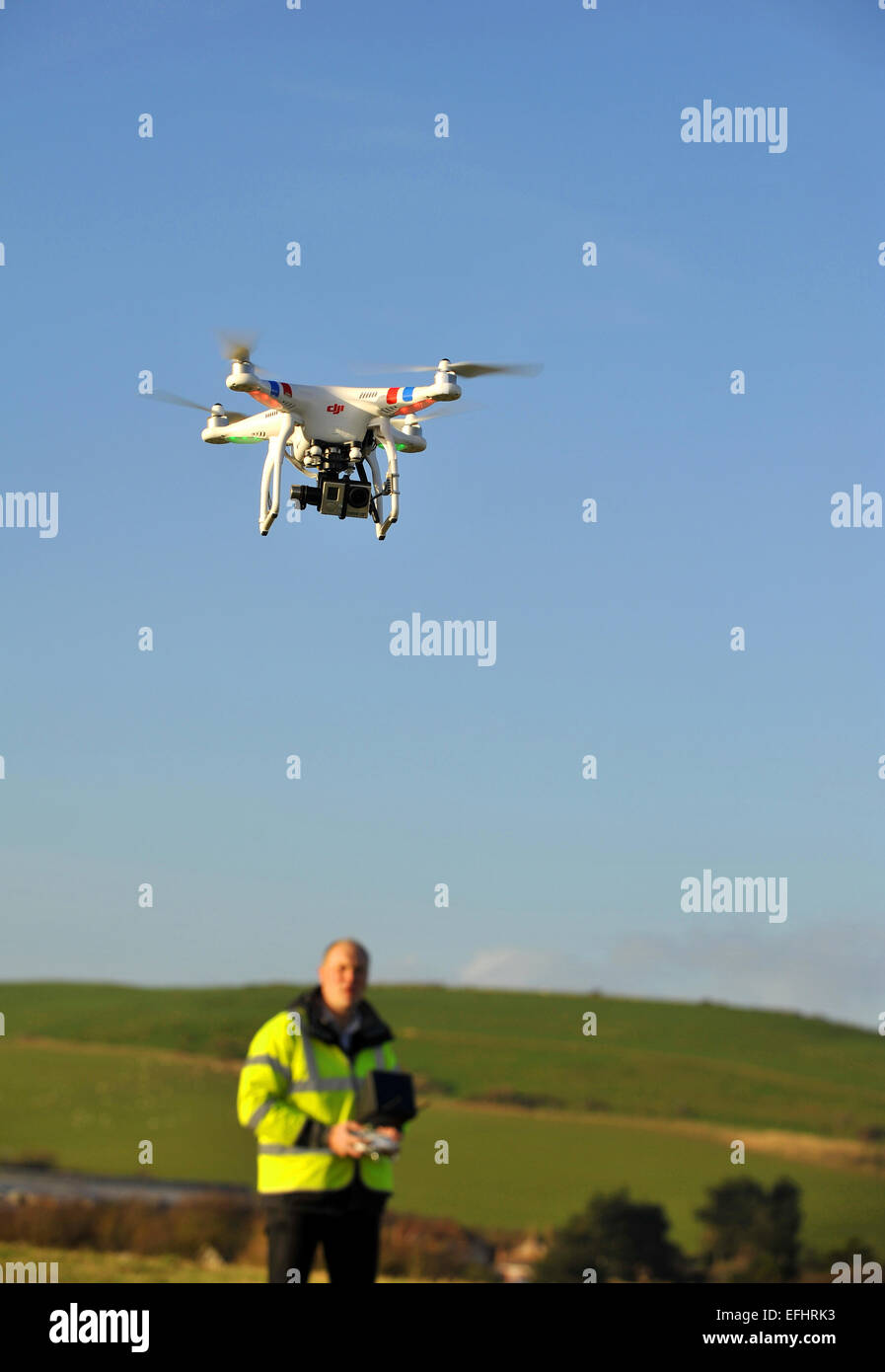 Drone camera in flight, Unmanned Aerial Vehicle, UAV or Drone, aerial photography or filming Stock Photo