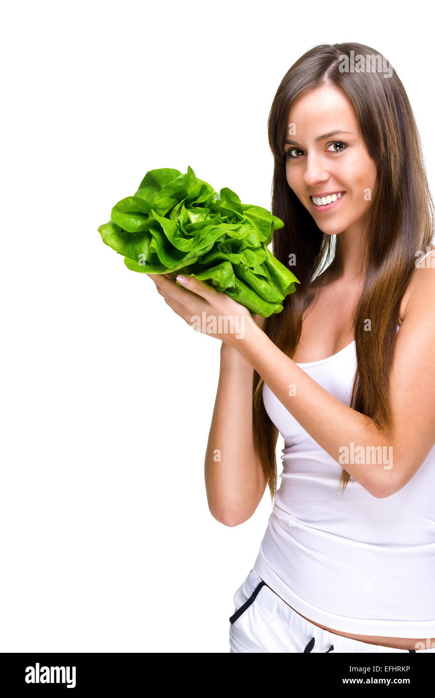 Healthful eating-Beautiful fit woman holding a salad. Stock Photo
