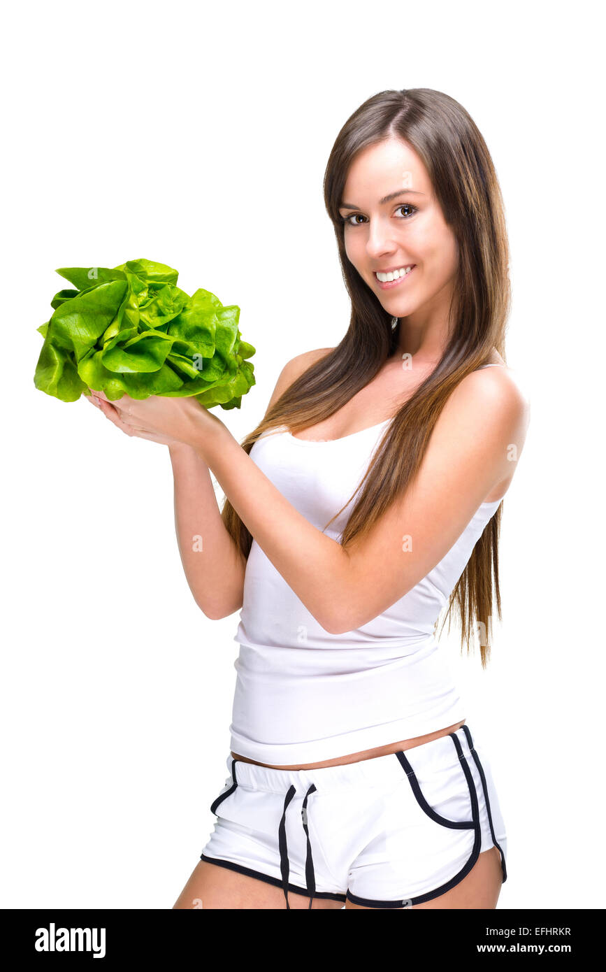 Healthful eating-Beautiful fit woman holding a salad. Stock Photo