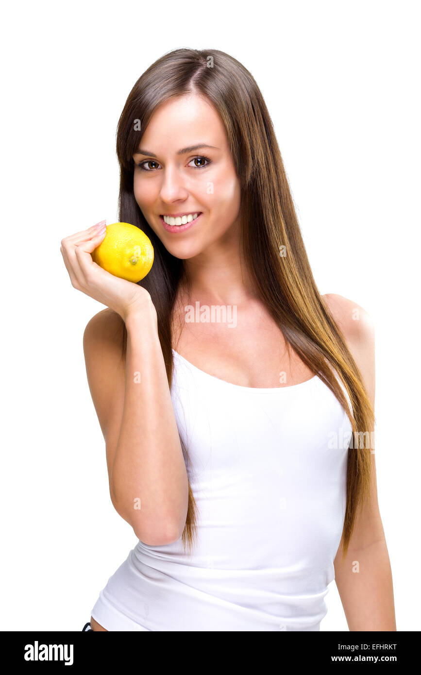 Healthful eating-a beautiful woman holding the oranges Stock Photo