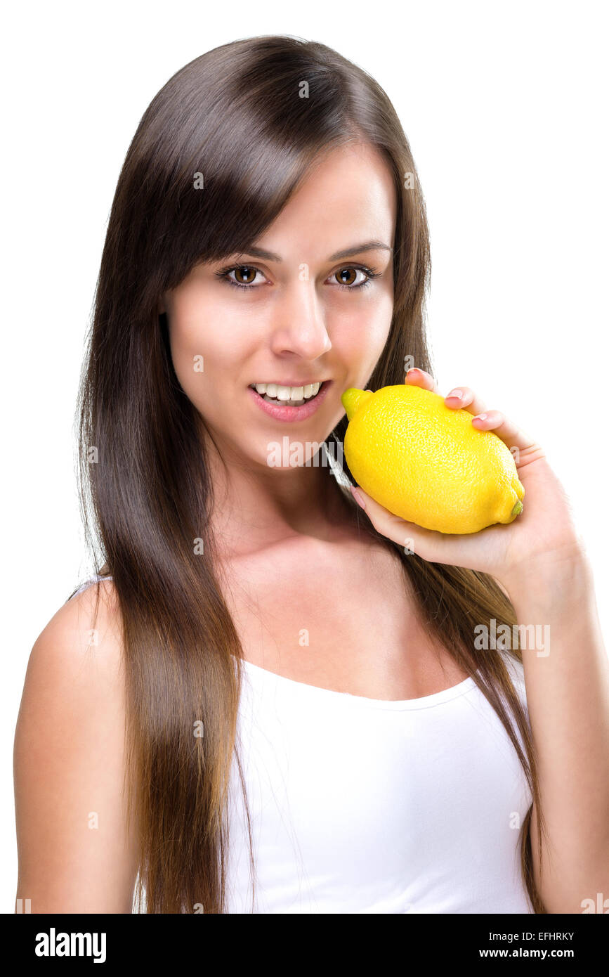 Healthy lifestyle - Beautiful pretty woman bites a lemon Stock Photo