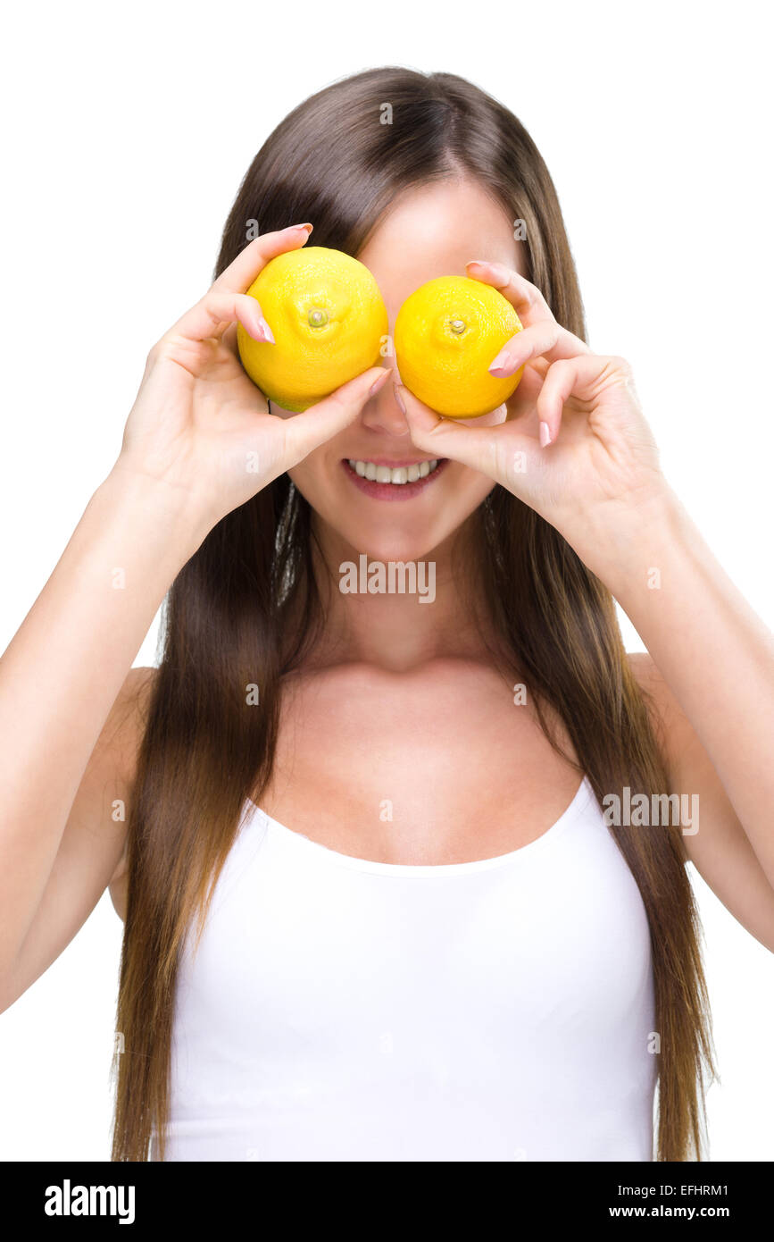 Healthy lifestyle - Fitt woman , before the eyes of two lemons Stock Photo
