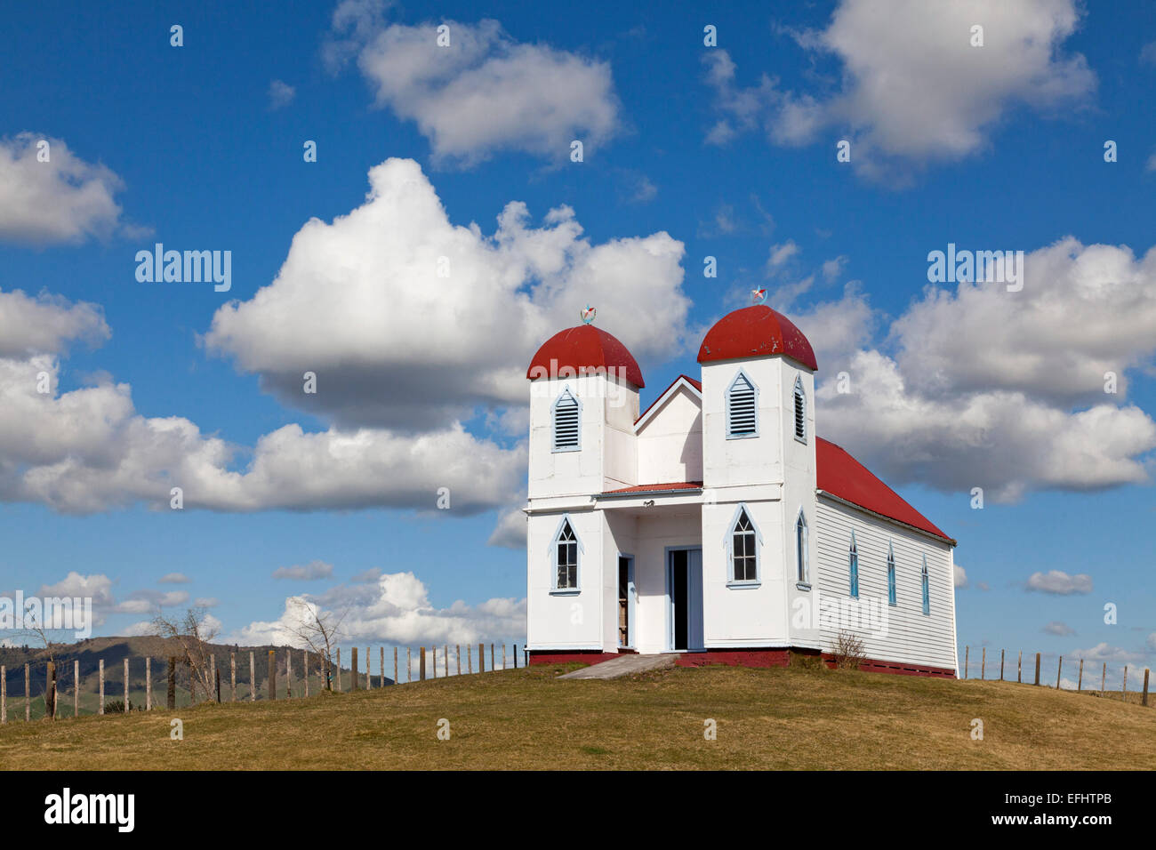Ratana church on a hill near Raetihi, White church with red roof and twin towers representing Alpha and Omega, Ratana is a Maori Stock Photo