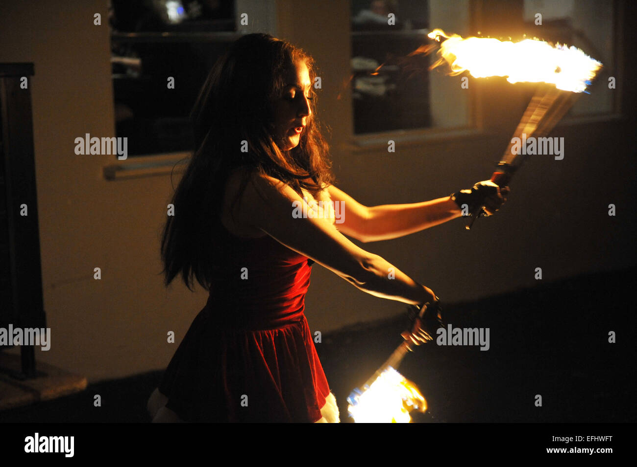 Fire eater entertainment at an opening party night. Stock Photo