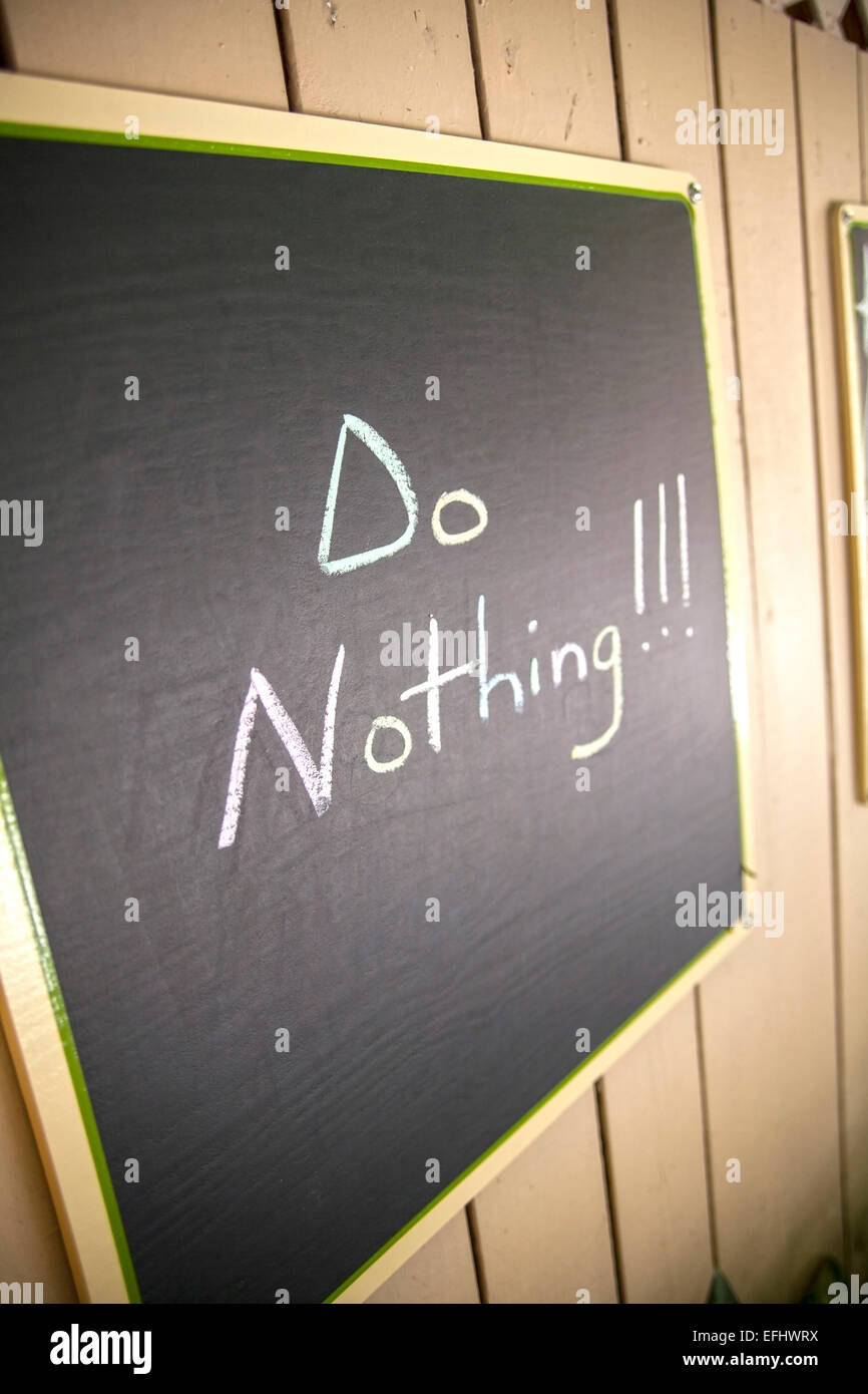 Blackboard with relaxing slogan of the day, Do Nothing, Little Palm Island Resort, Florida Keys, USA Stock Photo