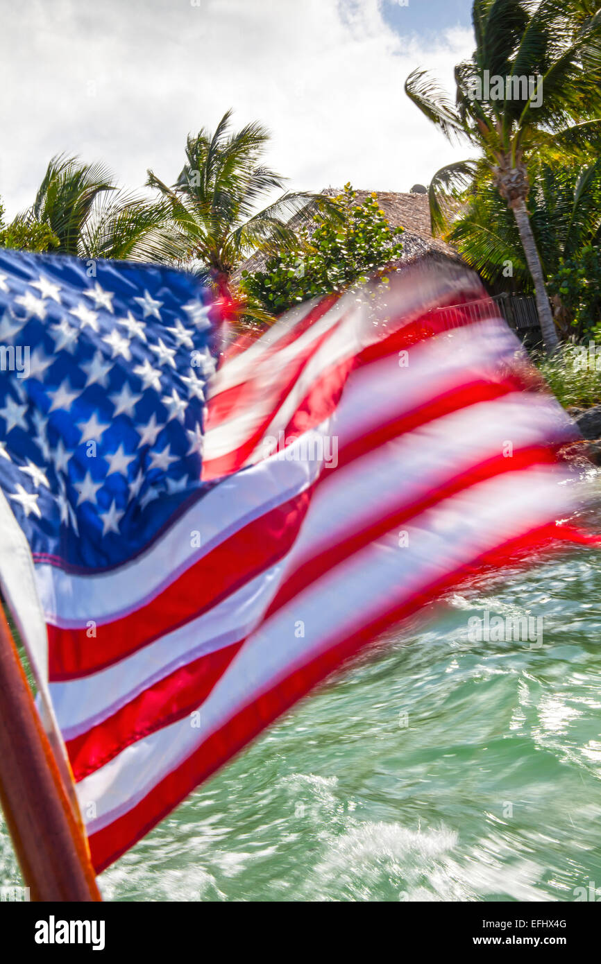 US Flag on a boat leaving Little Palm Island, Little Palm Island Resort, Florida Keys, USA Stock Photo