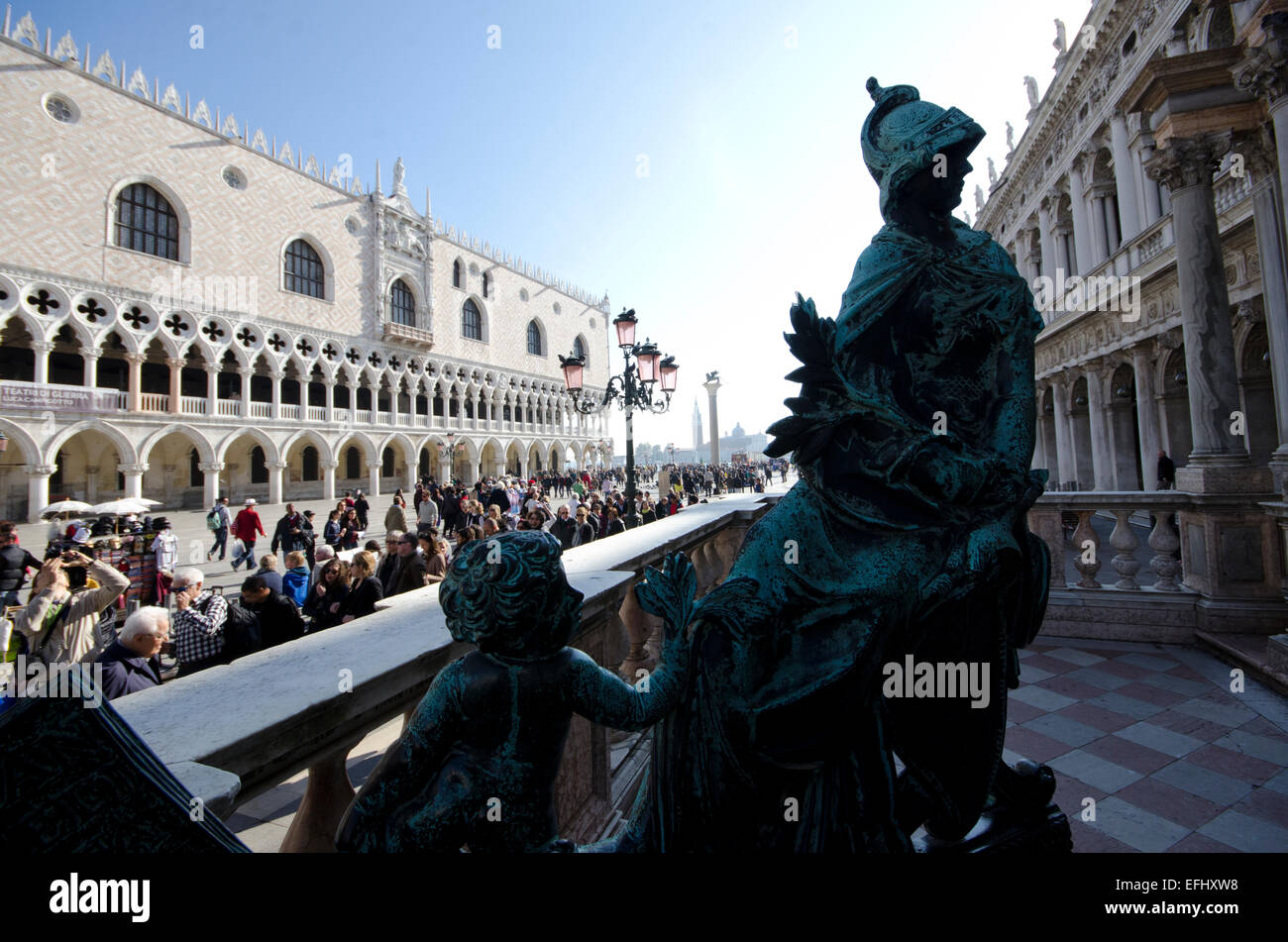 Statue at the entrance to the St. Mark's Campanile showing Doge's Palace in Venice, Italy Stock Photo