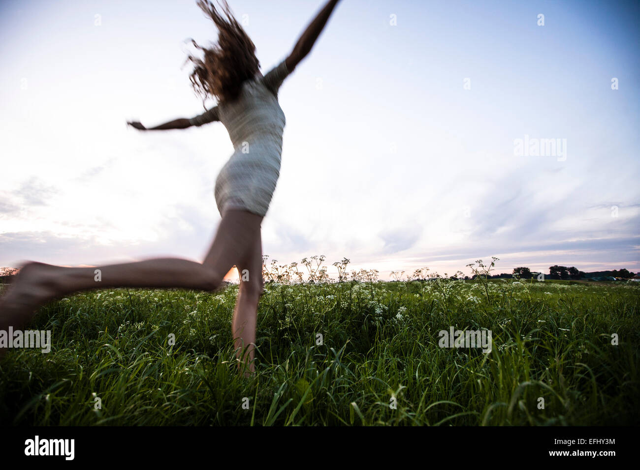 Woman running dress rear view hi-res stock photography and images - Alamy