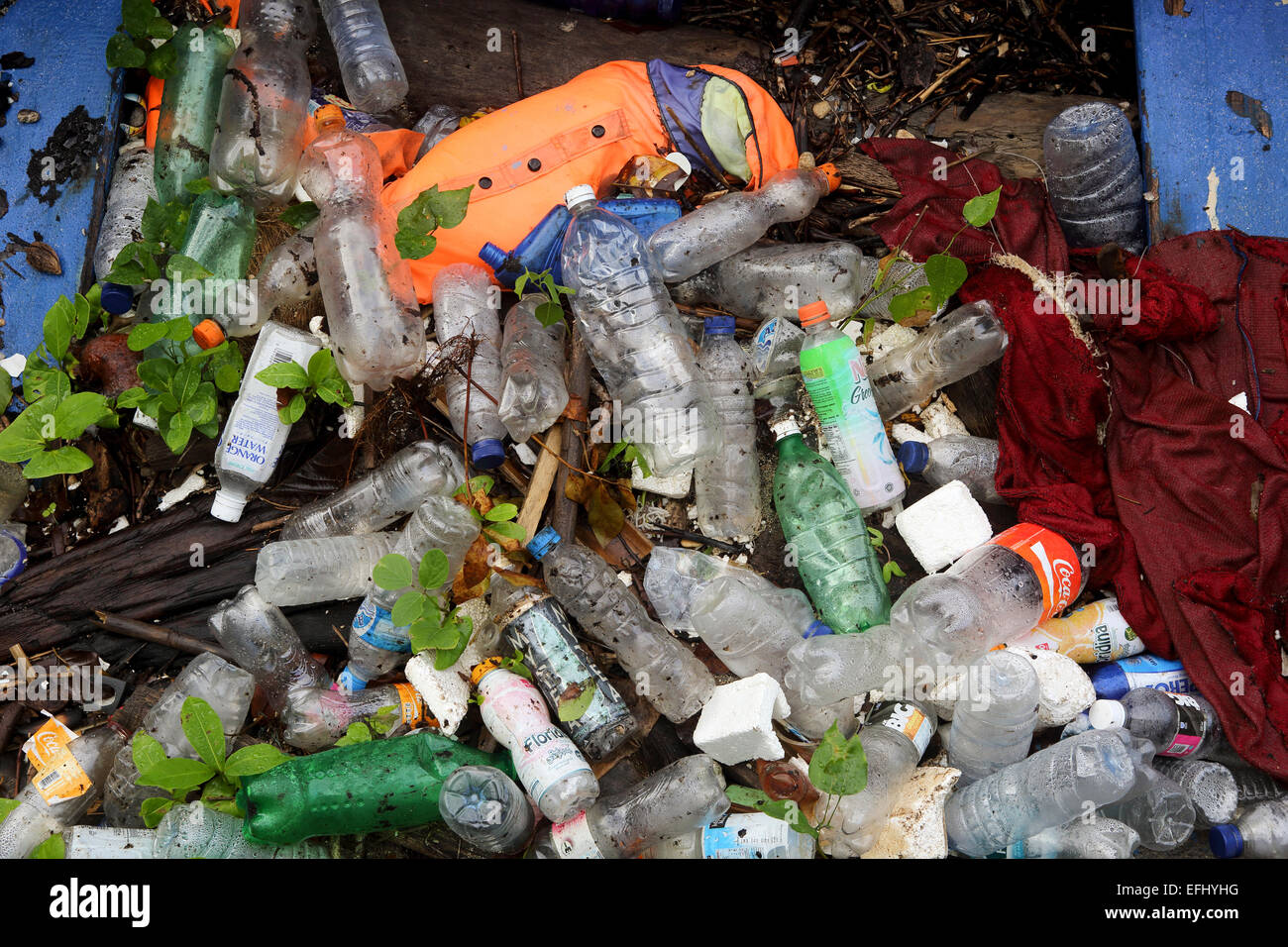 Plastic bottles and other trash polluting beach on Bunaken Island, Sulawesi Stock Photo