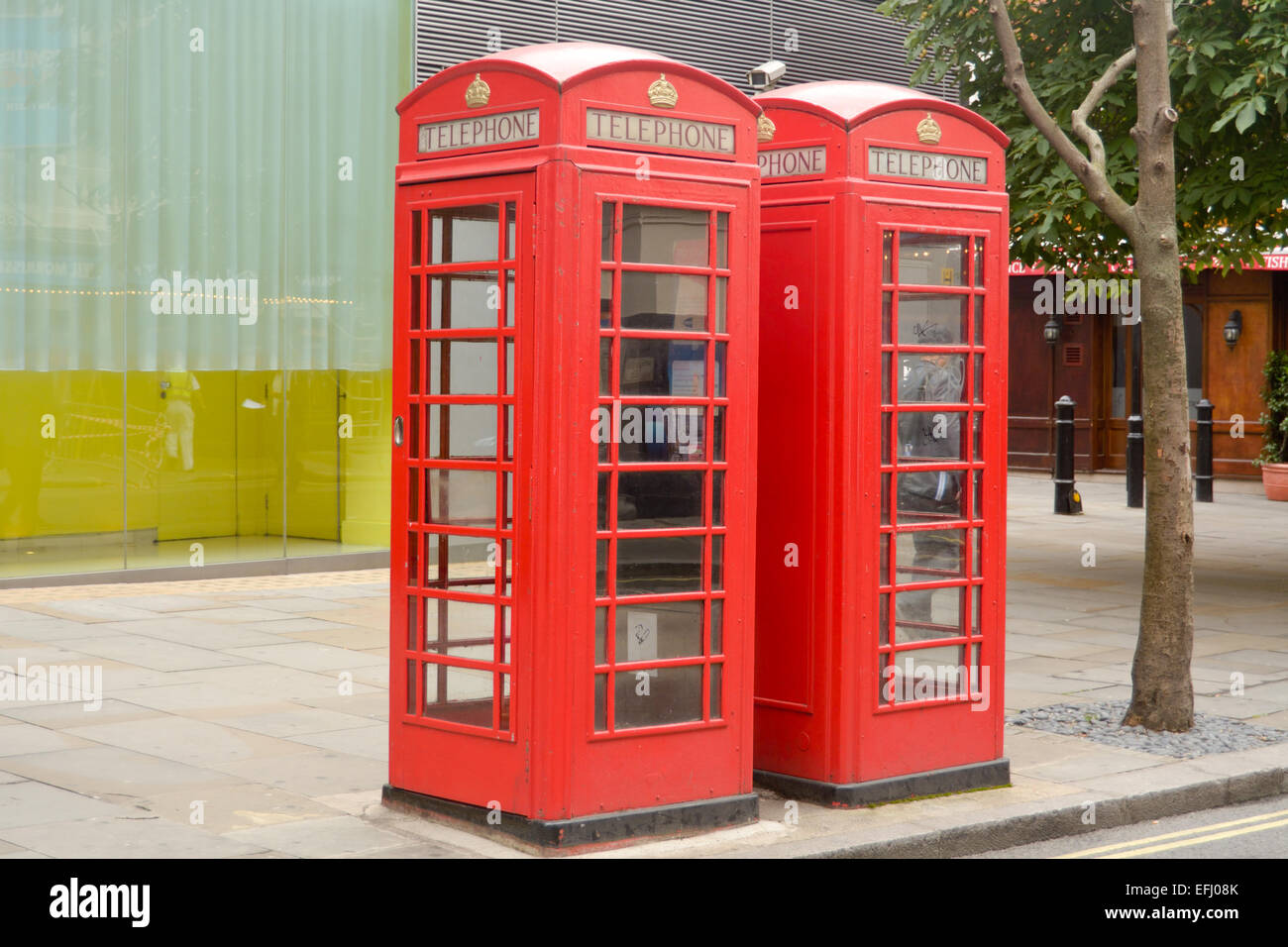 Two red phone boxes on street in London, England Stock Photo Alamy