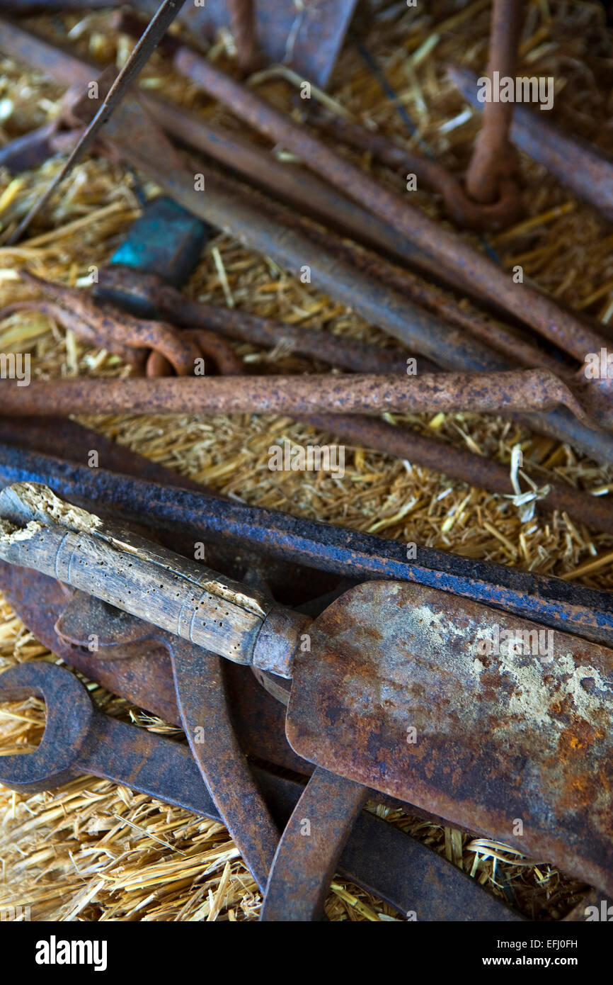 Old metal tools on straw Stock Photo Alamy