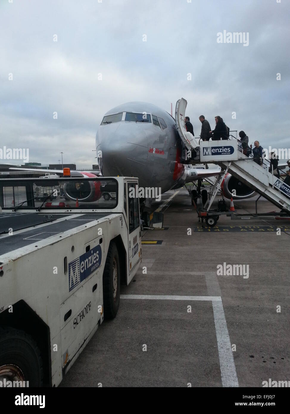 People boarding a lowcost airline at Manchester Airport Stock Photo