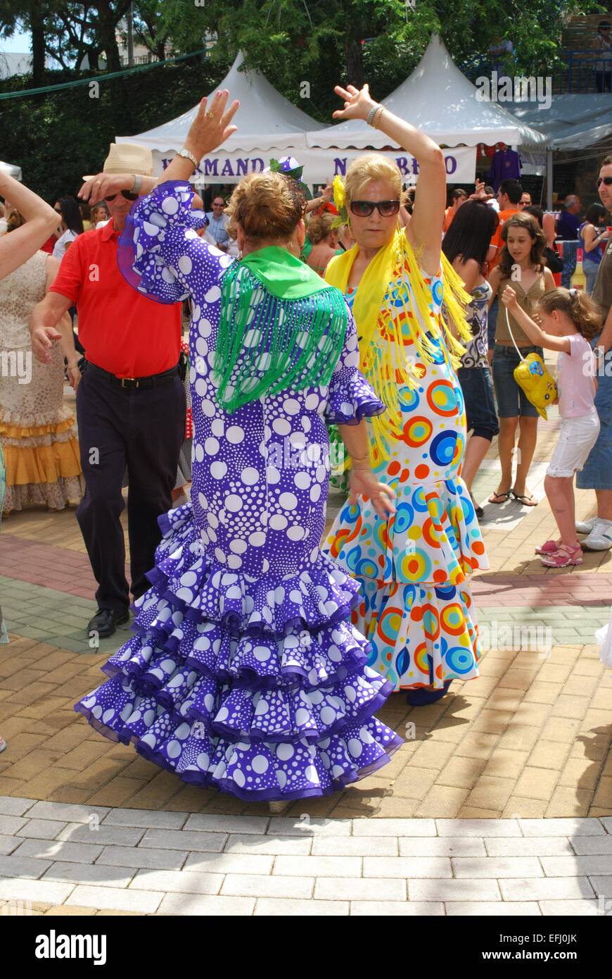 Spanish women flamenco dancing during the Romeria San Bernabe festival, Marbella, Costa del Sol