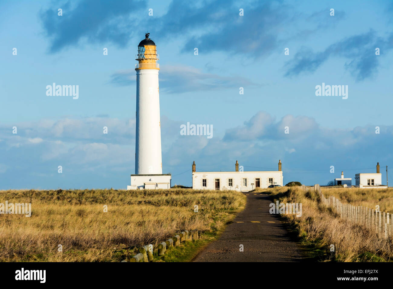 Barns Ness Lighthouse stands on the River Forth Estuary and is at the end of a winding, single track road near Torness nuclear power station. Stock Photo