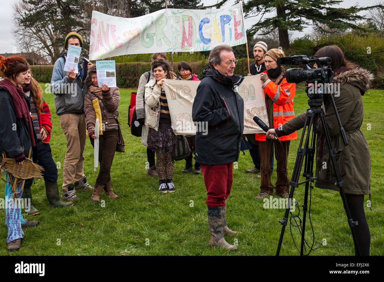 Bristol, UK. 5th February, 2015. Environment Secretary, Elizabeth Truss planted the one millionth tree as part of the Defra-led, Big Tree Plant scheme which began in 2010. The ceremony in Bristol's Eastville Park was hijacked by local protesters who are opposed to a new bus scheme which will see the destruction of green space currently used by local community project, Feed Bristol.  Also present at the ceremony was elected mayor George Ferguson, Pauline Black of the Big Tree Plant and Sir Harry Studholme from the Forestry Commission. Credit:  Redorbital Photography/Alamy Live News Stock Photo