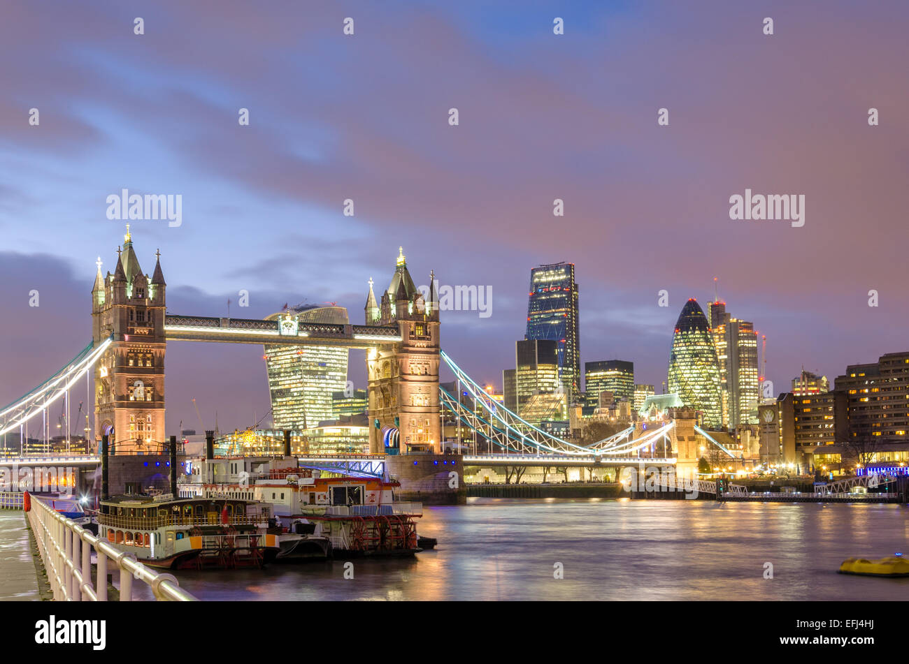London Southbank at night showing an iconic London skyline including Tower Bridge and the City of London Stock Photo