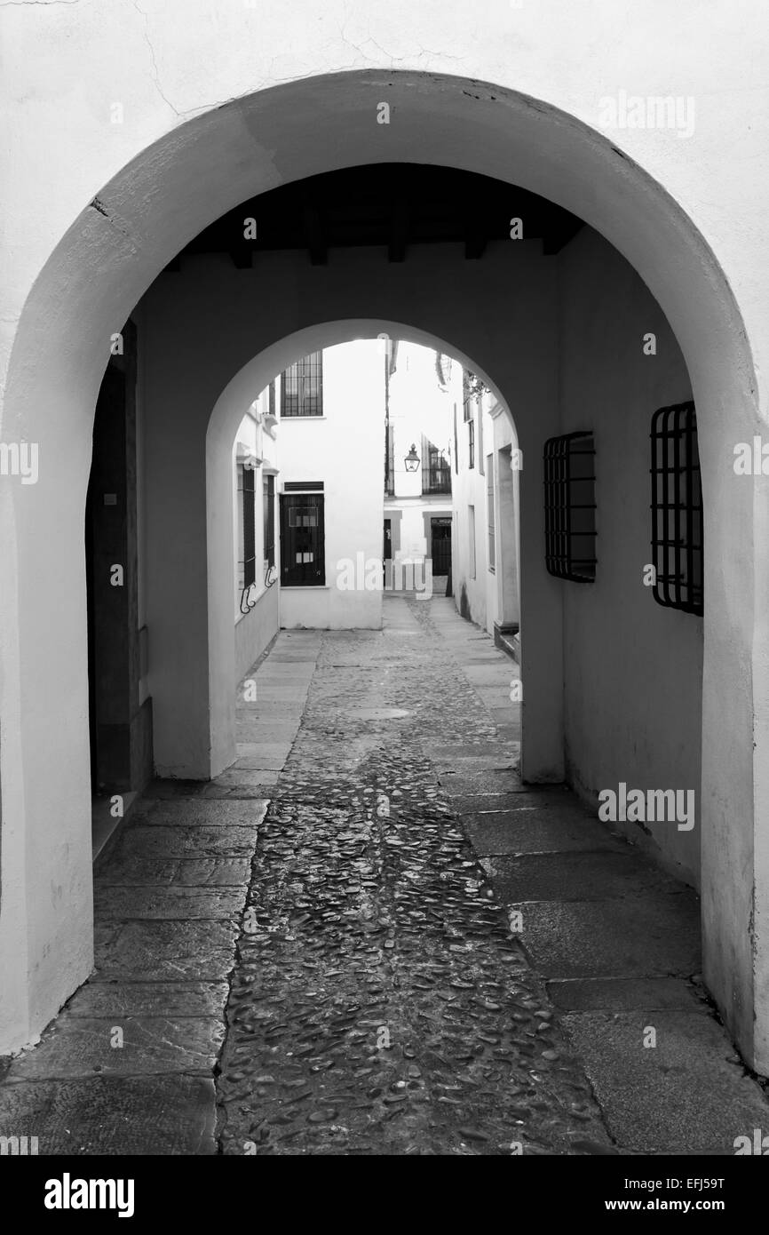 Old narrow street in Cordoba. Black and white image Stock Photo