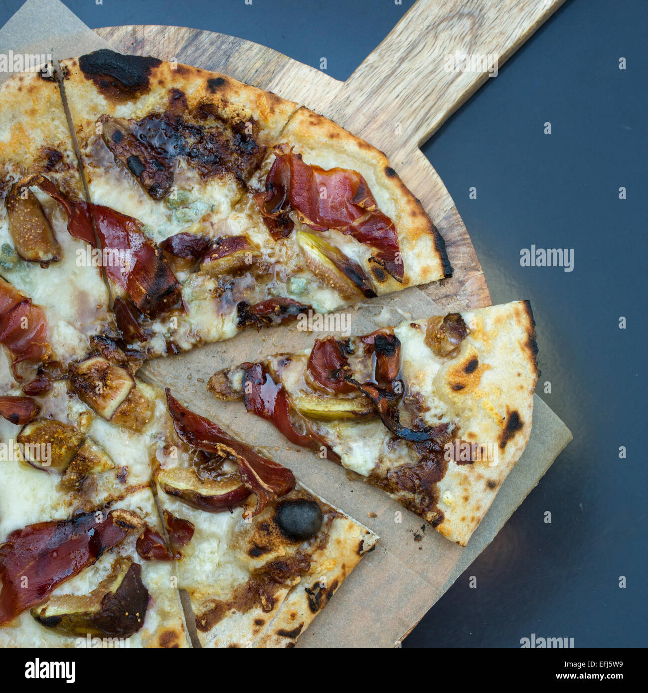 Figs, asiago, dolce, speck (lightly smoked prosciutto) pizza Stock Photo Alamy