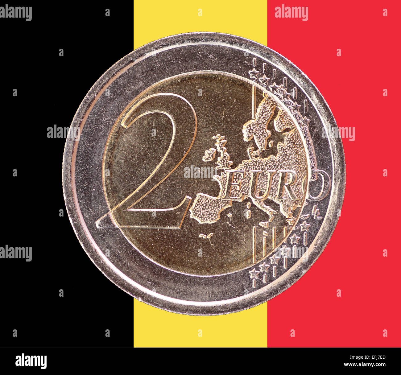 Common face of two euros coin isolated on the national flag of Belgium as background Stock Photo