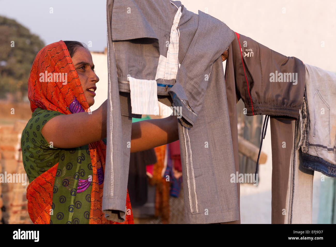 indian-woman-washing-clothes-outside-hi-res-stock-photography-and