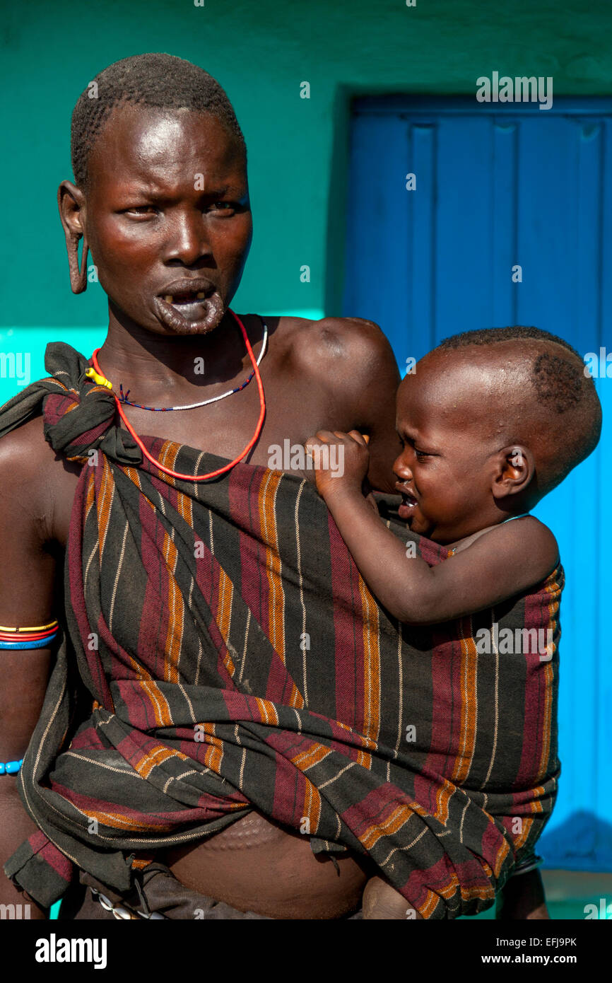 Portrait Of A Woman and Baby From The Mursi Tribe, Jinka Town, Omo Valley, Ethiopia Stock Photo