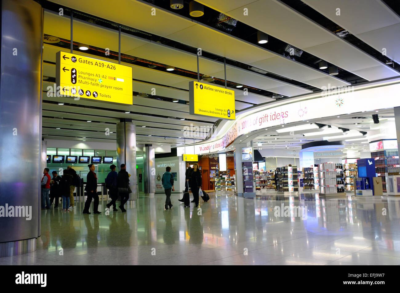 Information boards inside Heathrow airport in the UK. Stock Photo