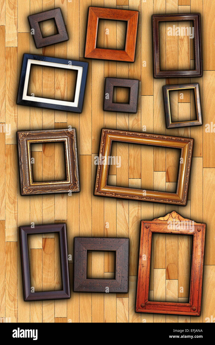 old painting wooden frames on wall backdrop Stock Photo
