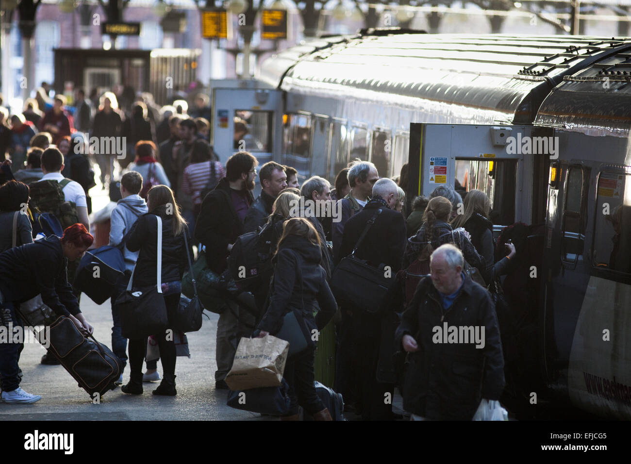 Waiting to board a train hi-res stock photography and images - Alamy