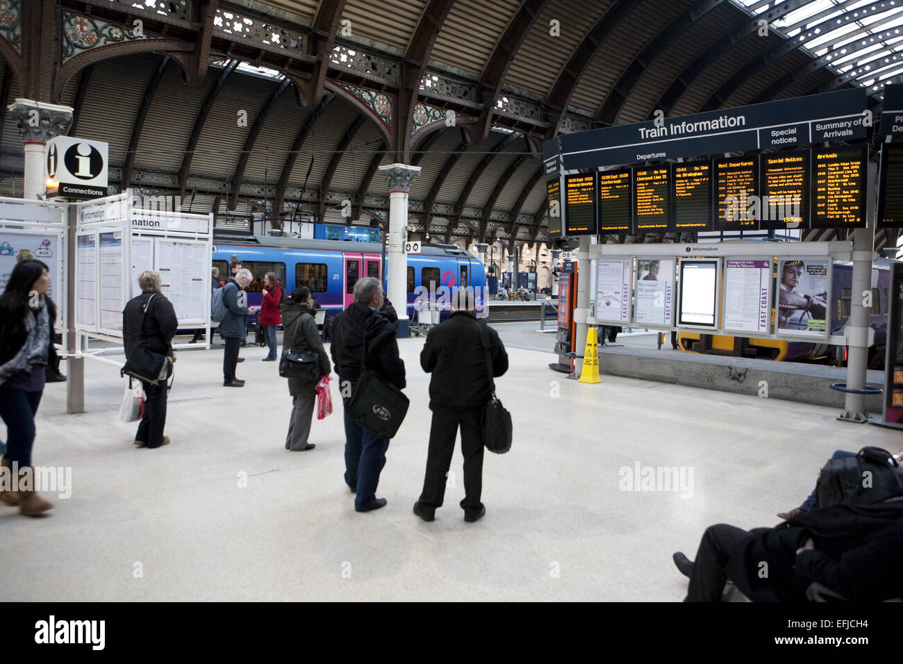 Passengers at York Railway station waiting for trains Stock Photo