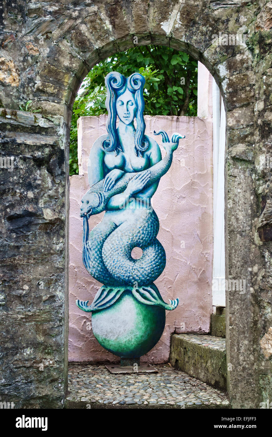 Portmeirion, North Wales, the Italianate folly built by Clough Williams-Ellis. A mermaid made from sheet metal stands in the old tollgate Stock Photo