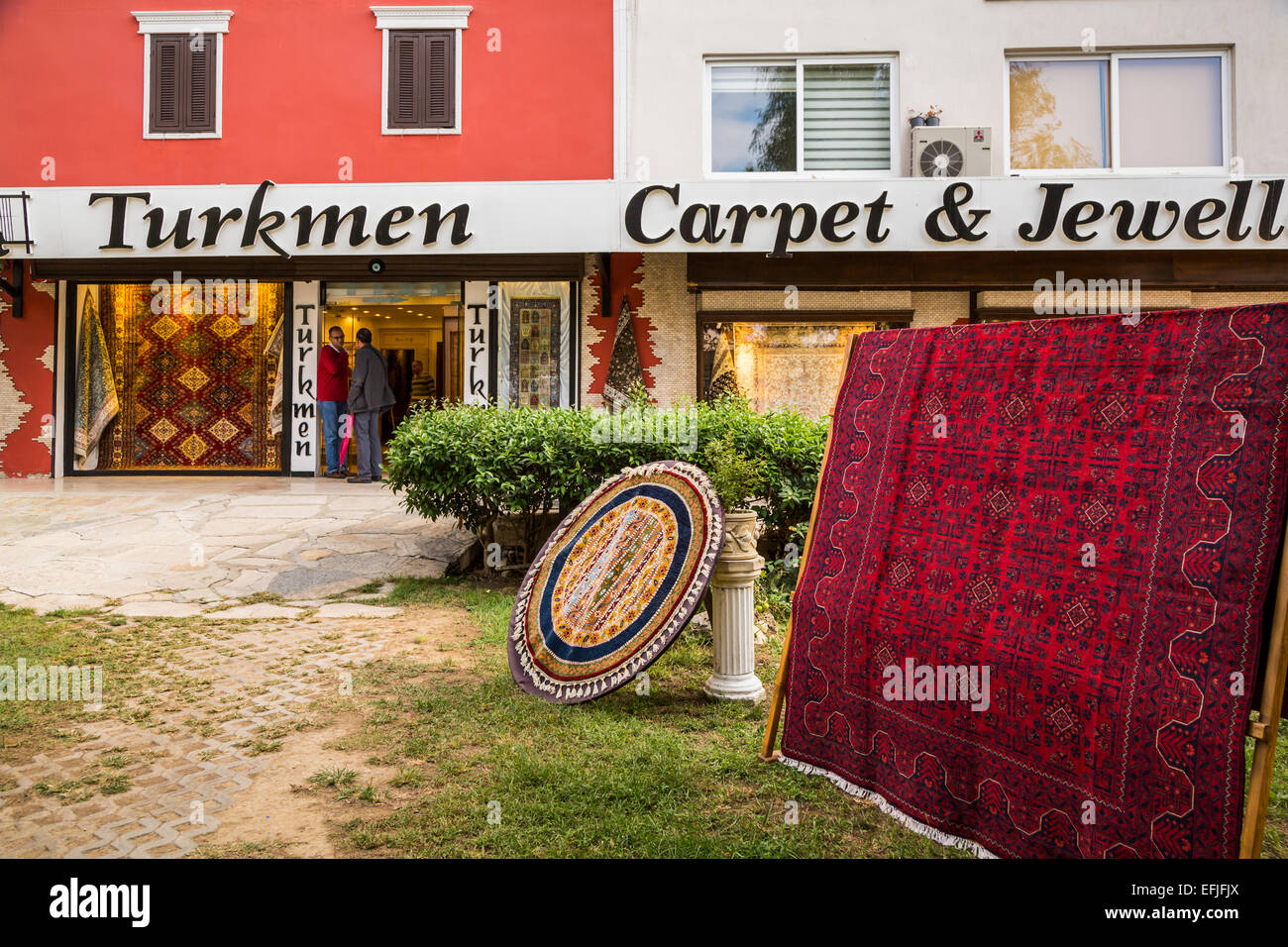 An outdoor display of Turkish carpets in Kusadasi, Turkey, Eurasia. Stock Photo