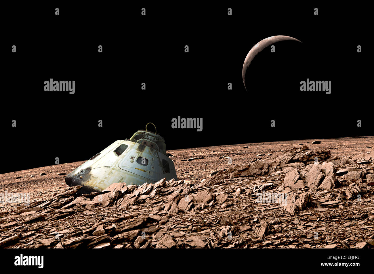 A scorched space capsule lies abandoned on a barren and airless moon. Stock Photo