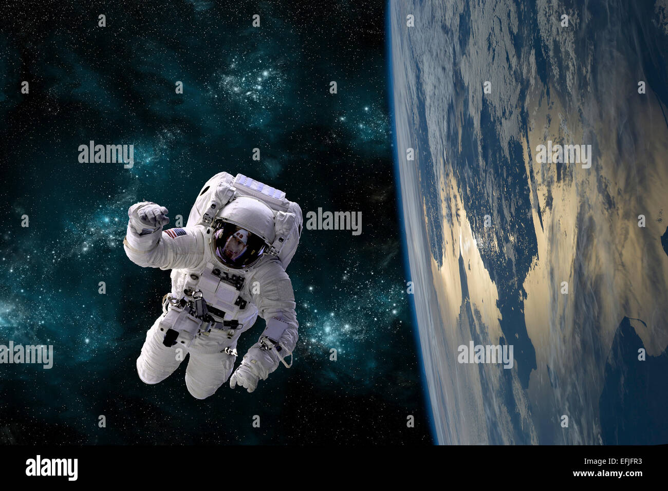 An artist's depiction of an astronaut floating in space while orbiting a large, Earth-like planet. Stock Photo