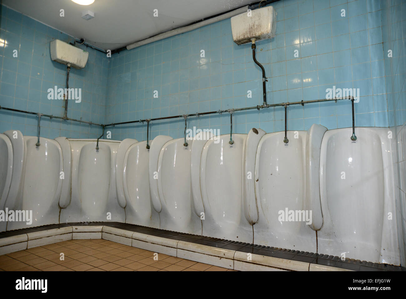 The inside of an old fashioned mens public toilet, Beach Green, Shoreham, East Sussex. Stock Photo