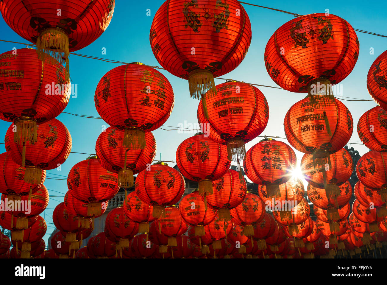Chinese Lanterns over clear blue sky and temple Stock Photo