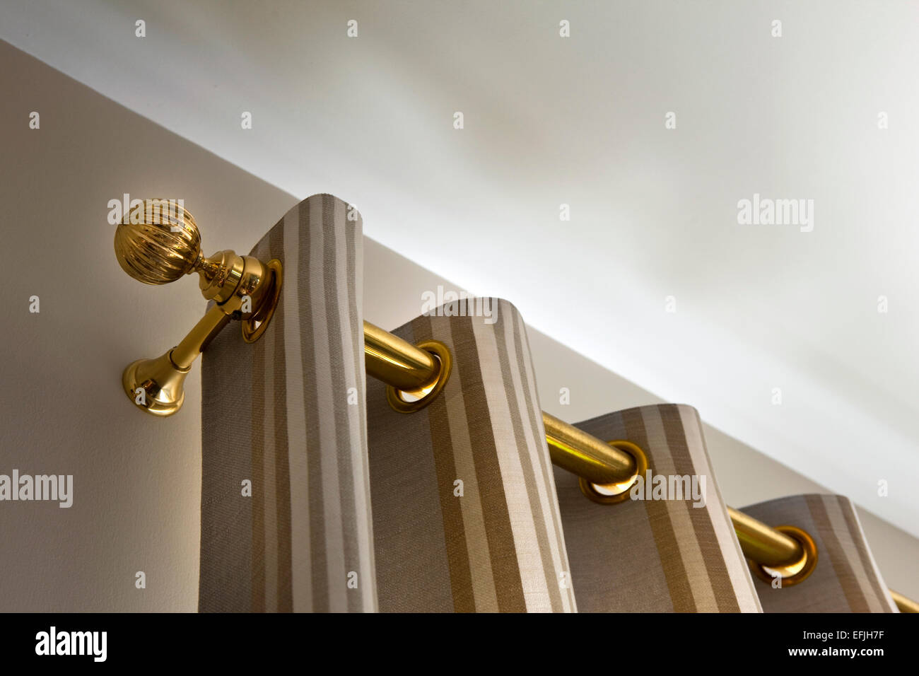 Brass curtain rod in a house Stock Photo Alamy