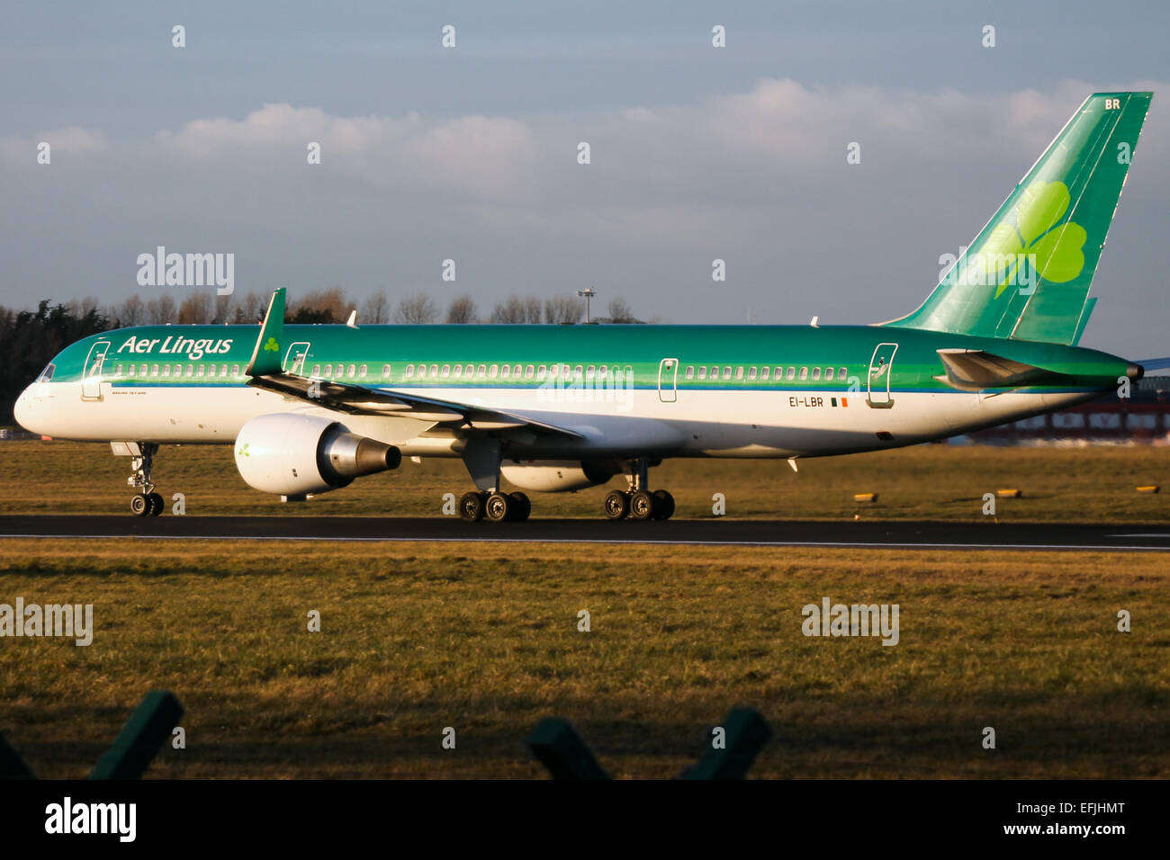 Aer Lingus Boeing 757-200 accelerates down runway 28 at Dublin airport. Stock Photo