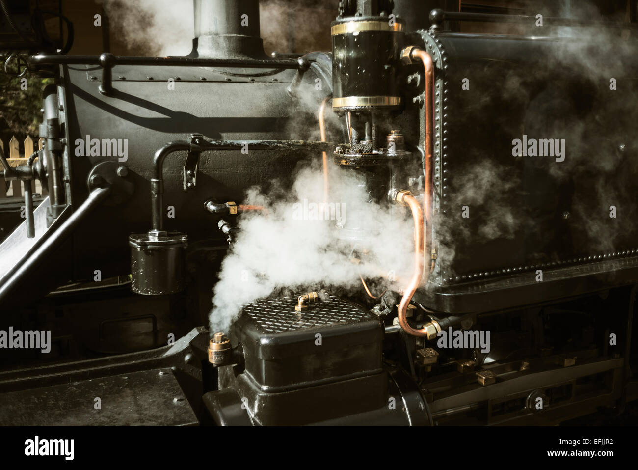 close up of steam coming out from locomotive Stock Photo