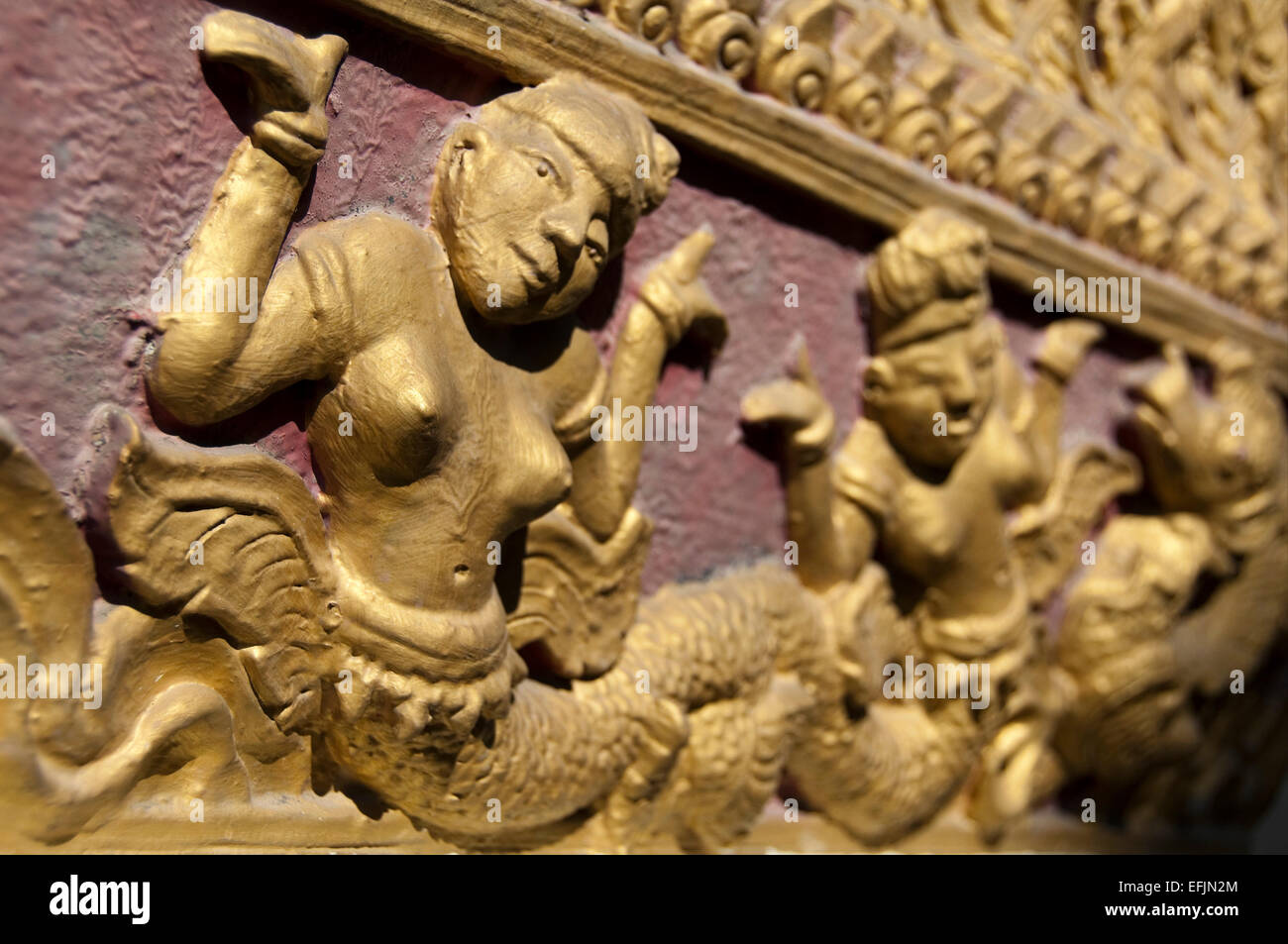 Horizontal close up view of the decorated walls at Wat Phan An in Chiang Mai. Stock Photo