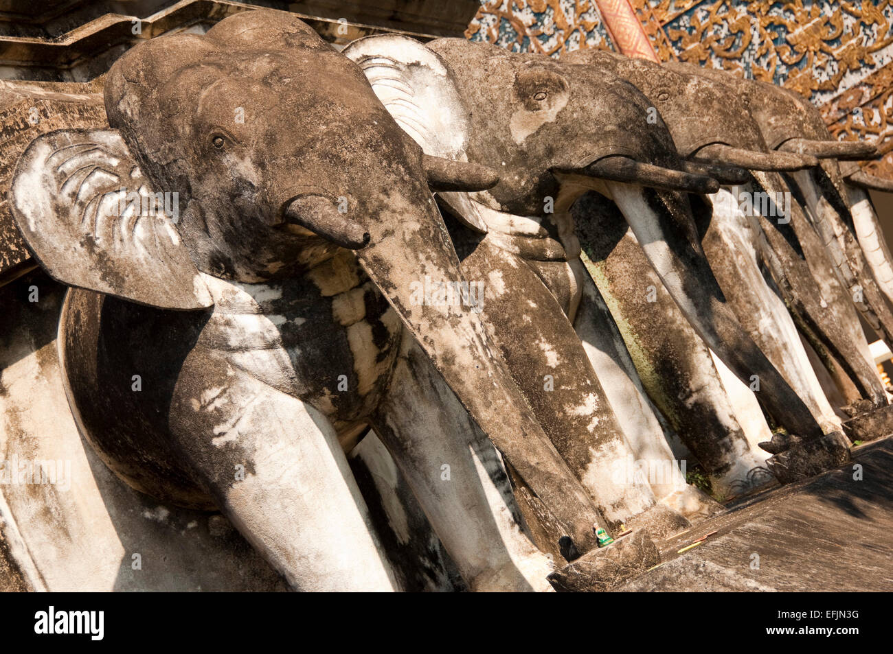 Horizontal close up view of the stone elephants supporting the chedi at Wat Chiang Man. Stock Photo