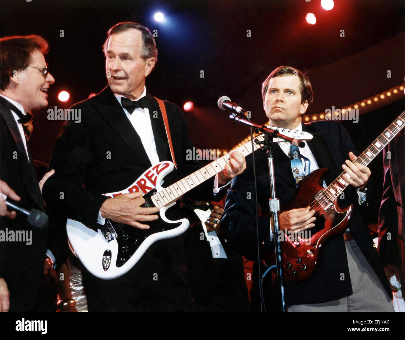 US President George H.W. Bush and political advisor Lee Atwater play the guitar at the Celebration for Young Americans, part of the inaugural celebration in the DC Armory January 21, 1989 in Washington, DC. Stock Photo