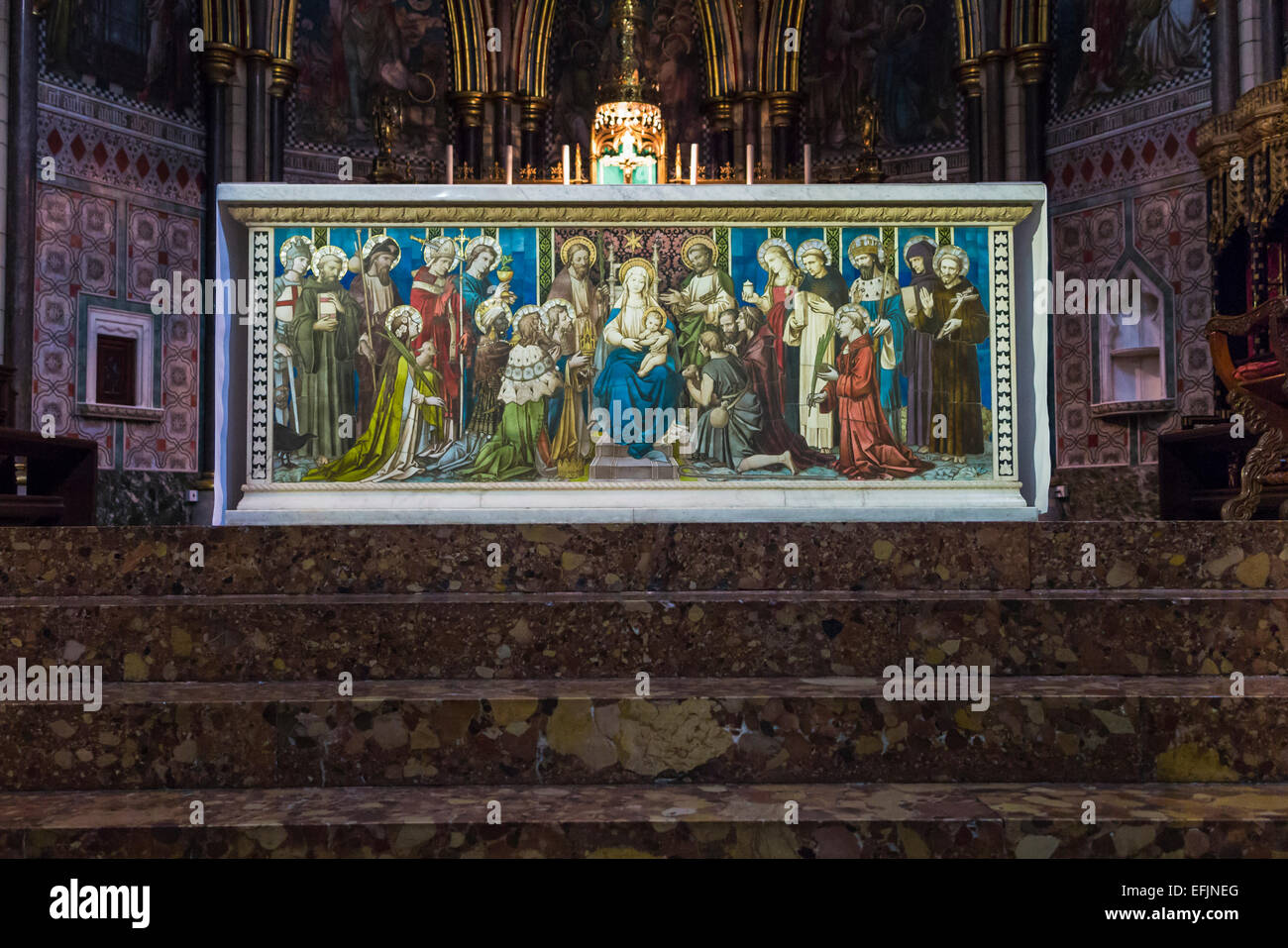 Colourful painted altar of the adoration of the Madonna and child at St