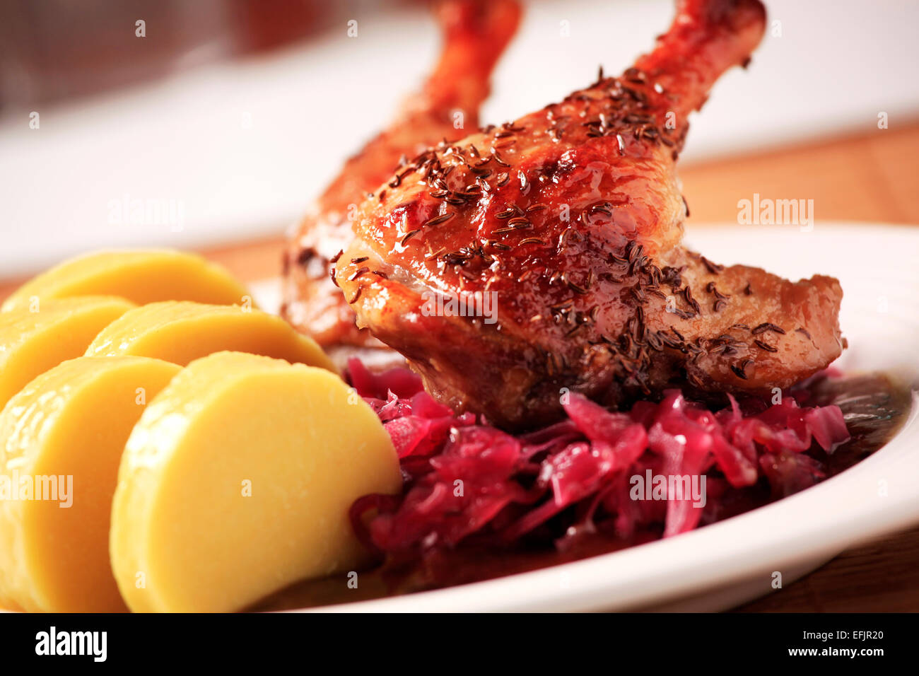 Roast Duck Legs with Red Cabbage and Potato Dumplings Stock Photo - Alamy