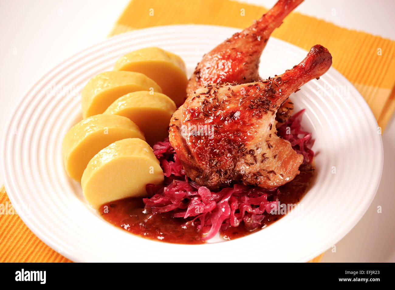 Roast Duck Legs with Red Cabbage and Potato Dumplings Stock Photo - Alamy